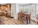 Charming breakfast nook with wooden table set by bright windows at 2880 Chelsea N Pl, Clearwater, FL 33759