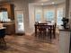 Inviting breakfast nook adjacent to kitchen, featuring a table, chairs and exterior access at 2880 Chelsea N Pl, Clearwater, FL 33759
