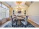 Cozy dining room with a chandelier, decorated ceiling and a large window at 2880 Chelsea N Pl, Clearwater, FL 33759