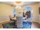 Well decorated dining room with chandelier and beautiful arched doorway at 2880 Chelsea N Pl, Clearwater, FL 33759