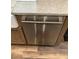 Stainless steel dishwasher seamlessly integrated into custom kitchen cabinetry at 2880 Chelsea N Pl, Clearwater, FL 33759