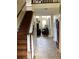 Inviting entryway with tile flooring, staircase, and view into the living area at 2880 Chelsea N Pl, Clearwater, FL 33759