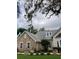 Close-up showcasing architectural details with stone accents,dormer window, and neutral color palette at 2880 Chelsea N Pl, Clearwater, FL 33759