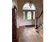 Beautiful foyer with tile floors, decorative door and staircase to the side at 2880 Chelsea N Pl, Clearwater, FL 33759