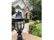Inviting walkway leading to the front entrance with decorative exterior lighting at 2880 Chelsea N Pl, Clearwater, FL 33759
