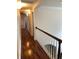 Hallway with hardwood floors, white trim, and bright lighting at 2880 Chelsea N Pl, Clearwater, FL 33759