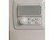 Close-up of an intercom system with buttons for source, set, privacy, listen, and talk at 2880 Chelsea N Pl, Clearwater, FL 33759