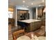 Open kitchen featuring a large island, stainless steel appliances, and wood cabinets at 2880 Chelsea N Pl, Clearwater, FL 33759