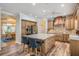 Open kitchen layout with a large island, stainless appliances and adjacent dining area at 2880 Chelsea N Pl, Clearwater, FL 33759