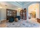 Cozy library featuring built-in bookshelves and comfortable seating at 2880 Chelsea N Pl, Clearwater, FL 33759
