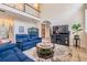 Spacious living room with vaulted ceilings and comfortable blue couches at 2880 Chelsea N Pl, Clearwater, FL 33759