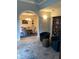 Cozy seating area with chairs, a rug, and an arched doorway into the dining room at 2880 Chelsea N Pl, Clearwater, FL 33759
