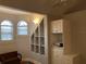 A home office with custom shelves and natural light at 2880 Chelsea N Pl, Clearwater, FL 33759