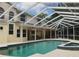 Exterior shot of pool and patio area, showcasing the size and layout of outdoor living at 2880 Chelsea N Pl, Clearwater, FL 33759