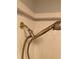 Updated shower head with chrome fixture in the shower with white tile at 2880 Chelsea N Pl, Clearwater, FL 33759