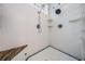 Shower featuring dual shower heads, tiled walls, and a glass block window for natural light at 2880 Chelsea N Pl, Clearwater, FL 33759