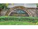 Chelsea Woods neighborhood sign surrounded by lush greenery at 2880 Chelsea N Pl, Clearwater, FL 33759