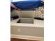 Under seat storage space with white trim and a floral pattern cushion at 2880 Chelsea N Pl, Clearwater, FL 33759