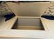 Under seat storage space with white trim and a floral pattern cushion at 2880 Chelsea N Pl, Clearwater, FL 33759