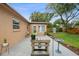 Backyard featuring a concrete patio, well-maintained landscaping, and lush greenery at 2887 Cathy Ln, Clearwater, FL 33760