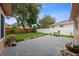 Fenced backyard with a concrete patio and green lawn, perfect for outdoor activities at 2887 Cathy Ln, Clearwater, FL 33760