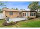 Backyard with a concrete patio, decorative landscaping, and ample space for outdoor activities at 2887 Cathy Ln, Clearwater, FL 33760