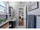 Bathroom featuring a vanity, mirror, tiled floor, and view into bedroom at 2887 Cathy Ln, Clearwater, FL 33760