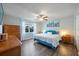 Cozy bedroom with a ceiling fan, dresser and comfortable bed at 2887 Cathy Ln, Clearwater, FL 33760