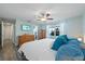 Bedroom view with vinyl flooring, ceiling fan, and bright windows showcasing natural light at 2887 Cathy Ln, Clearwater, FL 33760