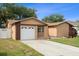 Cozy single-story home featuring a well-kept lawn, a one-car garage, and a private driveway at 2887 Cathy Ln, Clearwater, FL 33760