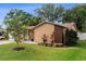 Well-maintained lawn, a one-car garage, and a private driveway, complemented by colorful landscaping at 2887 Cathy Ln, Clearwater, FL 33760