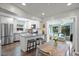 Modern kitchen with stainless steel appliances that flows into the dining and living areas at 2887 Cathy Ln, Clearwater, FL 33760