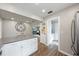 Bright kitchen with white cabinets, stainless steel appliances, and breakfast bar at 2887 Cathy Ln, Clearwater, FL 33760