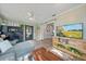 Comfortable living room with a view of the kitchen and a TV at 2887 Cathy Ln, Clearwater, FL 33760