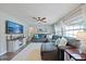 Spacious living room features a comfortable sectional sofa and an entertainment center at 2887 Cathy Ln, Clearwater, FL 33760