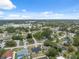 Neighborhood aerial view, showcasing residential streets, landscaped yards, and community amenities in the distance at 3312 Blythe Ave, Spring Hill, FL 34609