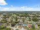 An elevated perspective of a residential neighborhood, highlighting the mix of homes and tree cover at 3312 Blythe Ave, Spring Hill, FL 34609