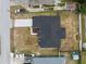 Bird's-eye view of a single-Gathering home featuring a dark roof, set within a rectangular lot at 3312 Blythe Ave, Spring Hill, FL 34609