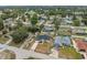 An aerial view of a residential neighborhood with well-maintained homes and green spaces at 3312 Blythe Ave, Spring Hill, FL 34609