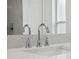 Close-up of a bright bathroom showcasing granite countertop and elegant fixtures at 3312 Blythe Ave, Spring Hill, FL 34609