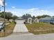 Charming single-story home with a well-manicured lawn, attached two-car garage, and inviting front entrance at 3312 Blythe Ave, Spring Hill, FL 34609