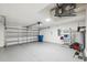 Spacious garage with ample storage and an automatic door opener at 3312 Blythe Ave, Spring Hill, FL 34609