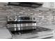 Close up of the modern stainless steel electric range with tile backsplash at 3312 Blythe Ave, Spring Hill, FL 34609
