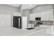 Modern kitchen featuring new appliances, an island and sleek countertops that are perfect for cooking at 3312 Blythe Ave, Spring Hill, FL 34609