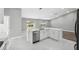 Bright kitchen with stainless steel appliances and a kitchen island allowing for easy food prep at 3312 Blythe Ave, Spring Hill, FL 34609