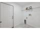 Laundry room featuring white walls and tile floors at 3312 Blythe Ave, Spring Hill, FL 34609