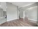 Open-concept living room with wood floors and view of the kitchen at 3312 Blythe Ave, Spring Hill, FL 34609