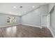 Spacious living room with wood floors, large window and bright natural light offering a relaxing area at 3312 Blythe Ave, Spring Hill, FL 34609