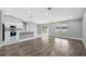 Open-concept living and kitchen area with lots of natural light, new appliances, and luxury vinyl flooring at 3312 Blythe Ave, Spring Hill, FL 34609