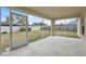 A view from the screened-in porch to the fenced in backyard at 3312 Blythe Ave, Spring Hill, FL 34609